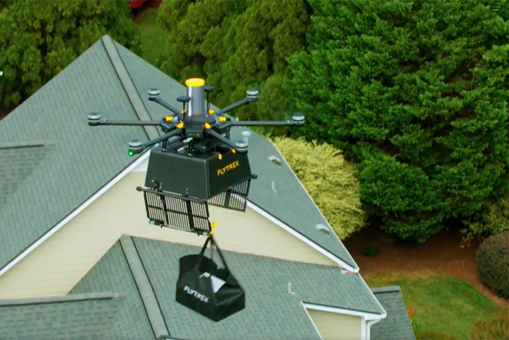 Flytrex drone delivering groceries to a home